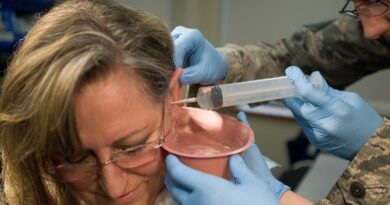 Cynthia Kruener has her ear canal washed Feb. 2, 2012, during a routine visit to the medical clinic at Dover Air Force Base, Del. Kruener underwent th