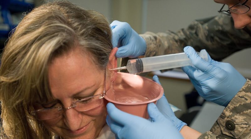 Cynthia Kruener has her ear canal washed Feb. 2, 2012, during a routine visit to the medical clinic at Dover Air Force Base, Del. Kruener underwent th