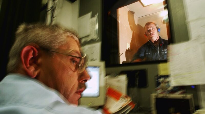 Pacific Ocean (Sept. 24, 2003) -- Hospital Corpsman 2nd Class William McKerrow administers a hearing test to Interior Communications Electrician 3rd C