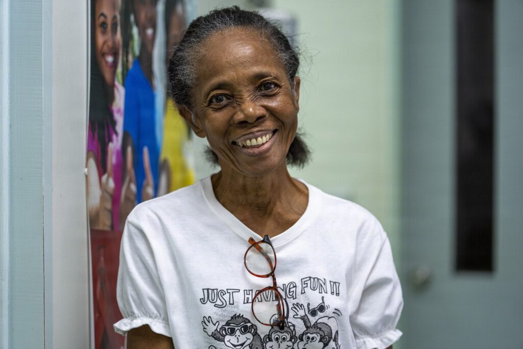 A 74 year old Kittitian audiology patient poses for a photo after a hearing aid fitting at the Pogson Medical Centre in Sandy Point, Saint Kitts and N