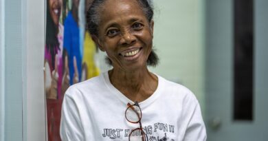 A 74 year old Kittitian audiology patient poses for a photo after a hearing aid fitting at the Pogson Medical Centre in Sandy Point, Saint Kitts and N