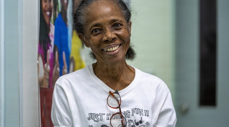 A 74 year old Kittitian audiology patient poses for a photo after a hearing aid fitting at the Pogson Medical Centre in Sandy Point, Saint Kitts and N