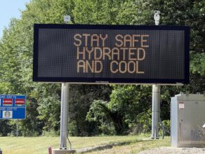 Variable message sign displaying "Stay Safe Hydrated And Cool" during triple-digit heat along northbound Interstate 295 just south of Exit 72 in Hopew